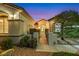 Charming home featuring a gated front courtyard with desert landscaping, lighting, and a welcoming ambiance at 1960 Oliver Springs St, Henderson, NV 89052