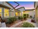 Inviting front courtyard with desert landscaping, stepping stones, lighting, and access to the main entrance at 1960 Oliver Springs St, Henderson, NV 89052