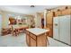 Kitchen with island, dining area, view to dining and living rooms, and a retro refrigerator at 1960 Oliver Springs St, Henderson, NV 89052