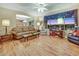Comfortable living room with a large window, hardwood floors, and a view of the backyard at 1960 Oliver Springs St, Henderson, NV 89052