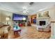 Bright living room featuring a fireplace, built-in shelves, and large windows offering a scenic view at 1960 Oliver Springs St, Henderson, NV 89052