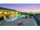 Inviting pool area surrounded by lush landscaping, offering a private outdoor retreat with great views at 1960 Oliver Springs St, Henderson, NV 89052