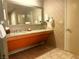 Modern bathroom with dual sinks, sleek granite countertop and walk-in shower at 211 E Flamingo Rd # 1012, Las Vegas, NV 89169