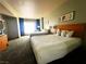 Comfortable bedroom with two queen beds and bright window at 211 E Flamingo Rd # 1012, Las Vegas, NV 89169