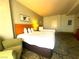 Cozy bedroom boasts comfortable bedding, patterned carpet, and relaxing seating at 211 E Flamingo Rd # 1012, Las Vegas, NV 89169