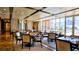 Bright dining room with large windows, comfortable seating, and views of the pool at 211 E Flamingo Rd # 1012, Las Vegas, NV 89169