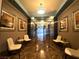Inviting hallway with tasteful artwork, comfortable seating, and elegant lighting at 211 E Flamingo Rd # 1012, Las Vegas, NV 89169