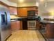 Efficient kitchen space with stainless steel appliances and dark countertops at 211 E Flamingo Rd # 1012, Las Vegas, NV 89169