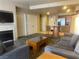 Spacious living room with kitchen, breakfast bar, fireplace, comfortable sofa and armchairs at 211 E Flamingo Rd # 1012, Las Vegas, NV 89169