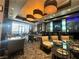 Stylish lounge area with comfortable seating, modern lighting, and a sleek bar area at 211 E Flamingo Rd # 1012, Las Vegas, NV 89169