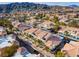 Aerial shot of a residential community showcasing well-maintained landscaping and mountain views at 2219 Rugged Mesa Dr, Laughlin, NV 89029