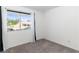 Well-lit bedroom with plush carpeting and a large window view at 2219 Rugged Mesa Dr, Laughlin, NV 89029