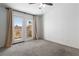 Light-filled bedroom boasting a ceiling fan and a private balcony to enjoy the outside view at 2219 Rugged Mesa Dr, Laughlin, NV 89029