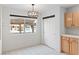 Bright dining area with modern lighting fixture and closet at 2219 Rugged Mesa Dr, Laughlin, NV 89029