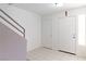 Entryway with staircase, coat closet, and tile flooring at 2219 Rugged Mesa Dr, Laughlin, NV 89029