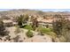 Buildings with well-maintained landscaping, desert plants, and walking paths at 2219 Rugged Mesa Dr, Laughlin, NV 89029
