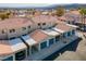 Rows of townhomes with carports, desert landscaping, and views of the surrounding mountains at 2219 Rugged Mesa Dr, Laughlin, NV 89029