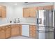Modern kitchen with stainless steel refrigerator and ample cabinet space at 2219 Rugged Mesa Dr, Laughlin, NV 89029