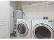 Efficient laundry area with washer, dryer, and water heater at 2219 Rugged Mesa Dr, Laughlin, NV 89029