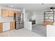 Open-concept living space with fireplace and modern appliances at 2219 Rugged Mesa Dr, Laughlin, NV 89029