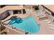 Aerial view of community pool, hot tub, desert landscaping, and shaded patio area at 2219 Rugged Mesa Dr, Laughlin, NV 89029