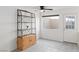 Well-lit room with ceiling fan and display shelving at 2219 Rugged Mesa Dr, Laughlin, NV 89029