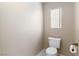Powder room featuring a clean toilet and practical accents at 2219 Rugged Mesa Dr, Laughlin, NV 89029