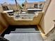 Private balcony view with a secure railing overlooking the parking area and surrounding community buildings at 2232 Aspen Mirror Dr # 203, Laughlin, NV 89029