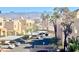 View of the building's exterior and carport parking, with a mountain view in the distance at 2232 Aspen Mirror Dr # 203, Laughlin, NV 89029