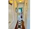 Hallway featuring wood floors and view of bedroom with blue curtains at 2232 Aspen Mirror Dr # 203, Laughlin, NV 89029