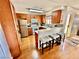 Charming kitchen with breakfast bar, light countertops, and stainless steel refrigerator at 2232 Aspen Mirror Dr # 203, Laughlin, NV 89029