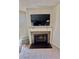 Living room featuring a fireplace with a mounted television above it at 2232 Aspen Mirror Dr # 203, Laughlin, NV 89029