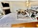 Cozy living room with carpet, fireplace, ceiling fan, and comfortable furnishings at 2232 Aspen Mirror Dr # 203, Laughlin, NV 89029