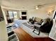 Open living room with fireplace, access to balcony, and seamless flow to other living areas at 2232 Aspen Mirror Dr # 203, Laughlin, NV 89029