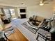 Bright living room with fireplace, sliding glass doors to balcony, and comfortable seating at 2232 Aspen Mirror Dr # 203, Laughlin, NV 89029