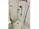 Updated glass door shower with white marble and modern finishes at 2232 Aspen Mirror Dr # 203, Laughlin, NV 89029