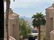 Condo view featuring palm trees and mountain views in the distance at 2232 Aspen Mirror Dr # 203, Laughlin, NV 89029