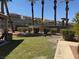 Well-maintained backyard with manicured lawn, privacy fence, and desert landscaping perfect for outdoor enjoyment at 2900 Sunridge Heights Pkwy # 816, Henderson, NV 89052