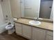 Bathroom with a white vanity, granite countertop, and combined tub and shower at 2900 Sunridge Heights Pkwy # 816, Henderson, NV 89052