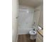 Bathroom featuring combined tub and shower with white tile and wood-look floors at 2900 Sunridge Heights Pkwy # 816, Henderson, NV 89052