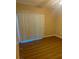 Bright bedroom with wood-look floors and large window with vertical blinds at 2900 Sunridge Heights Pkwy # 816, Henderson, NV 89052