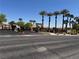 View of the Avalon community entrance with palm trees and desert landscaping on a clear day at 2900 Sunridge Heights Pkwy # 816, Henderson, NV 89052