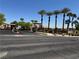 View of the Avalon community entrance with palm trees and desert landscaping on a clear day at 2900 Sunridge Heights Pkwy # 816, Henderson, NV 89052