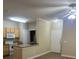This kitchen has white appliances and laminate flooring at 2900 Sunridge Heights Pkwy # 816, Henderson, NV 89052