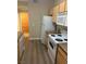 The kitchen has white appliances and laminate flooring at 2900 Sunridge Heights Pkwy # 816, Henderson, NV 89052