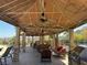 Inviting outdoor patio space with ceiling fans, comfortable seating, and an outdoor grilling area for entertaining guests at 2900 Sunridge Heights Pkwy # 816, Henderson, NV 89052