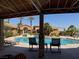 Community pool is surrounded by lush landscaping, seating and a sunning deck at 2900 Sunridge Heights Pkwy # 816, Henderson, NV 89052