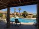 Community pool is surrounded by lush landscaping and seating area at 2900 Sunridge Heights Pkwy # 816, Henderson, NV 89052