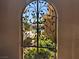 Arched wrought iron gate with view of a sparkling community pool at 2900 Sunridge Heights Pkwy # 816, Henderson, NV 89052