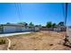 Large backyard offering ample space for gardening and outdoor activities with privacy fencing at 304 Elliott Ave, Las Vegas, NV 89106